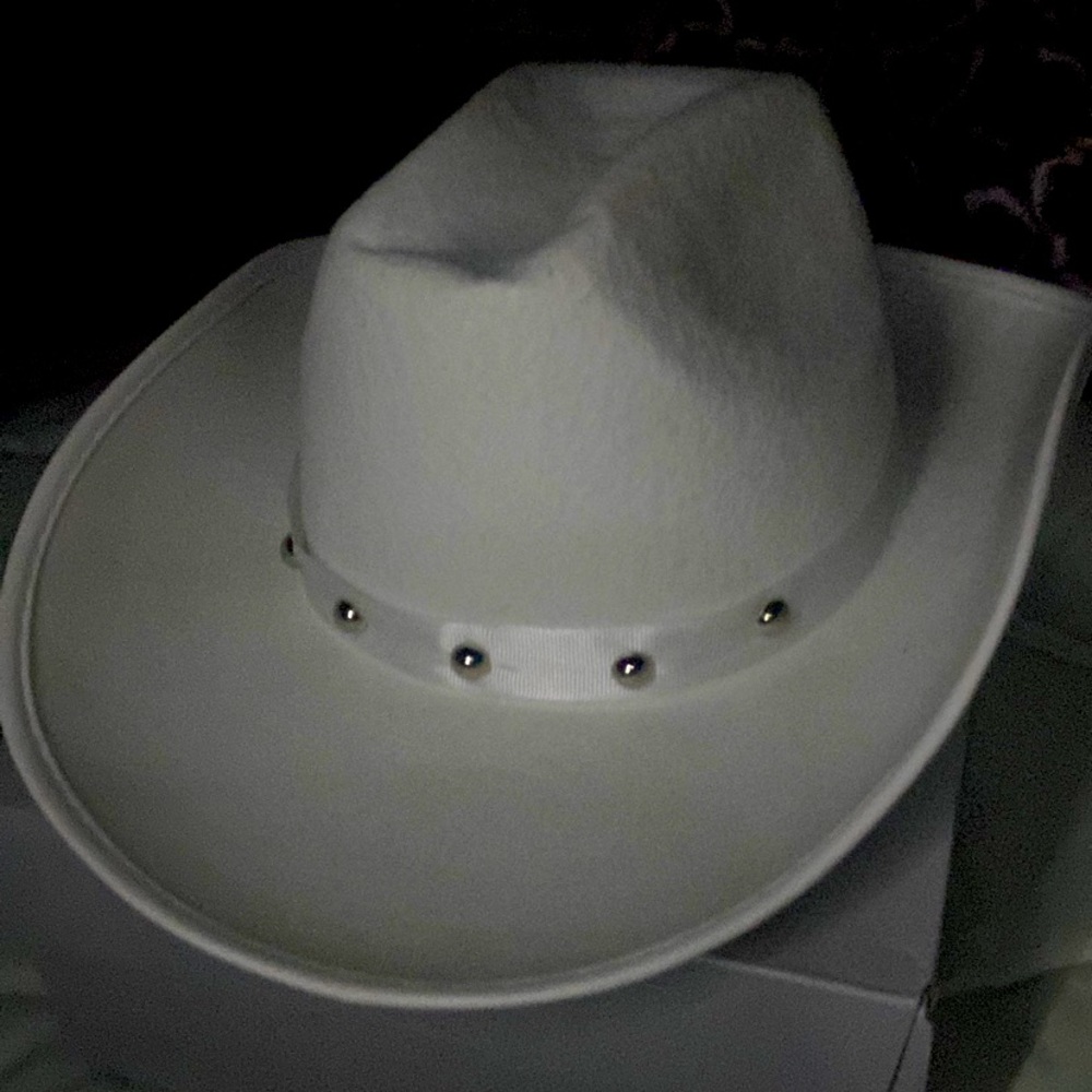 White hat with a ribbon wrapped